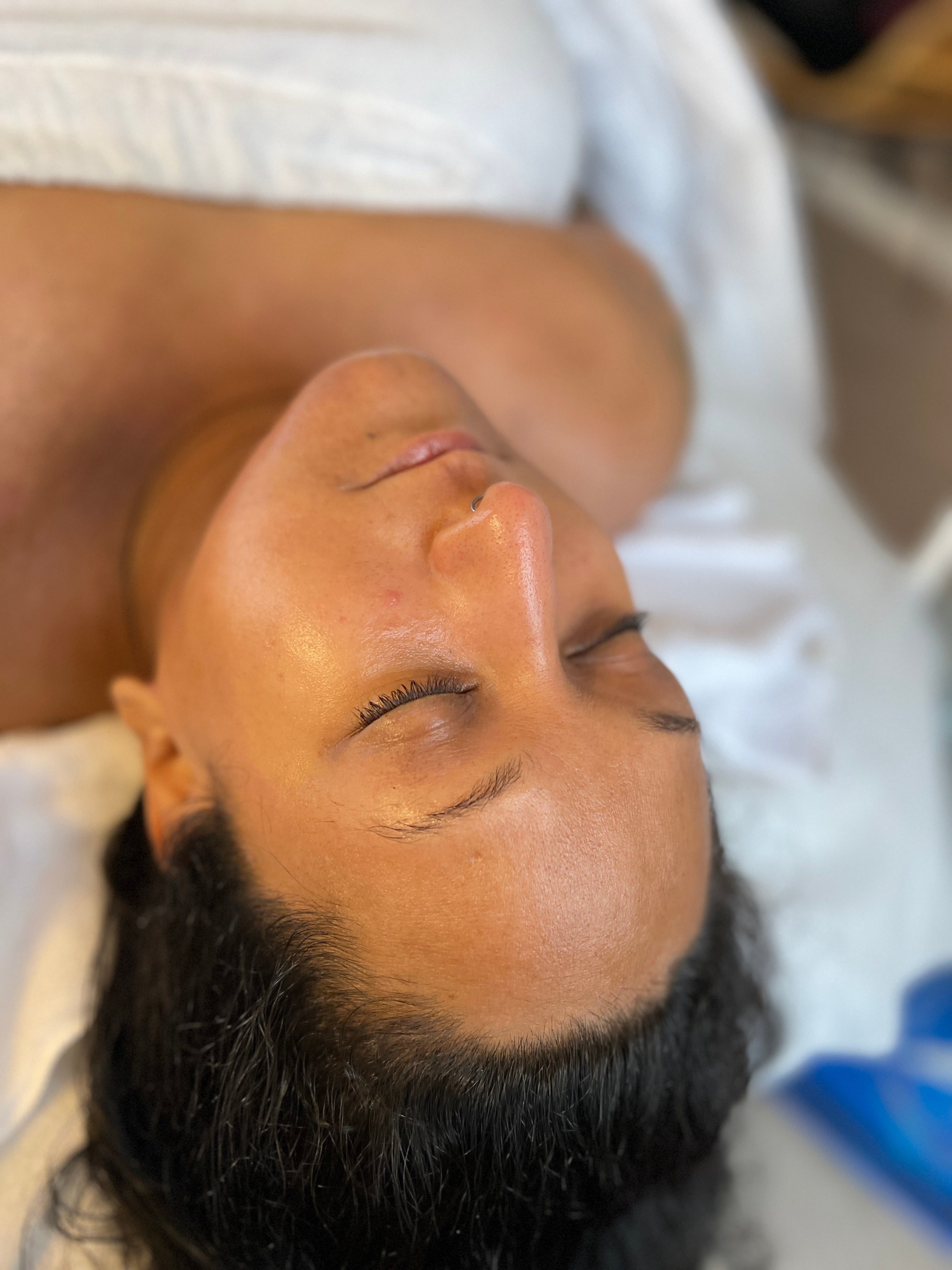 client with clear, radiant, age-defying skin as a result of facial membership.